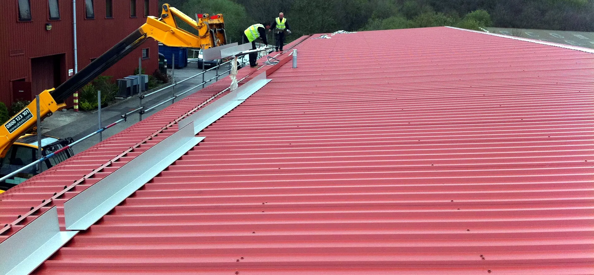 Profiled sheet re-roof, crane off-loading
